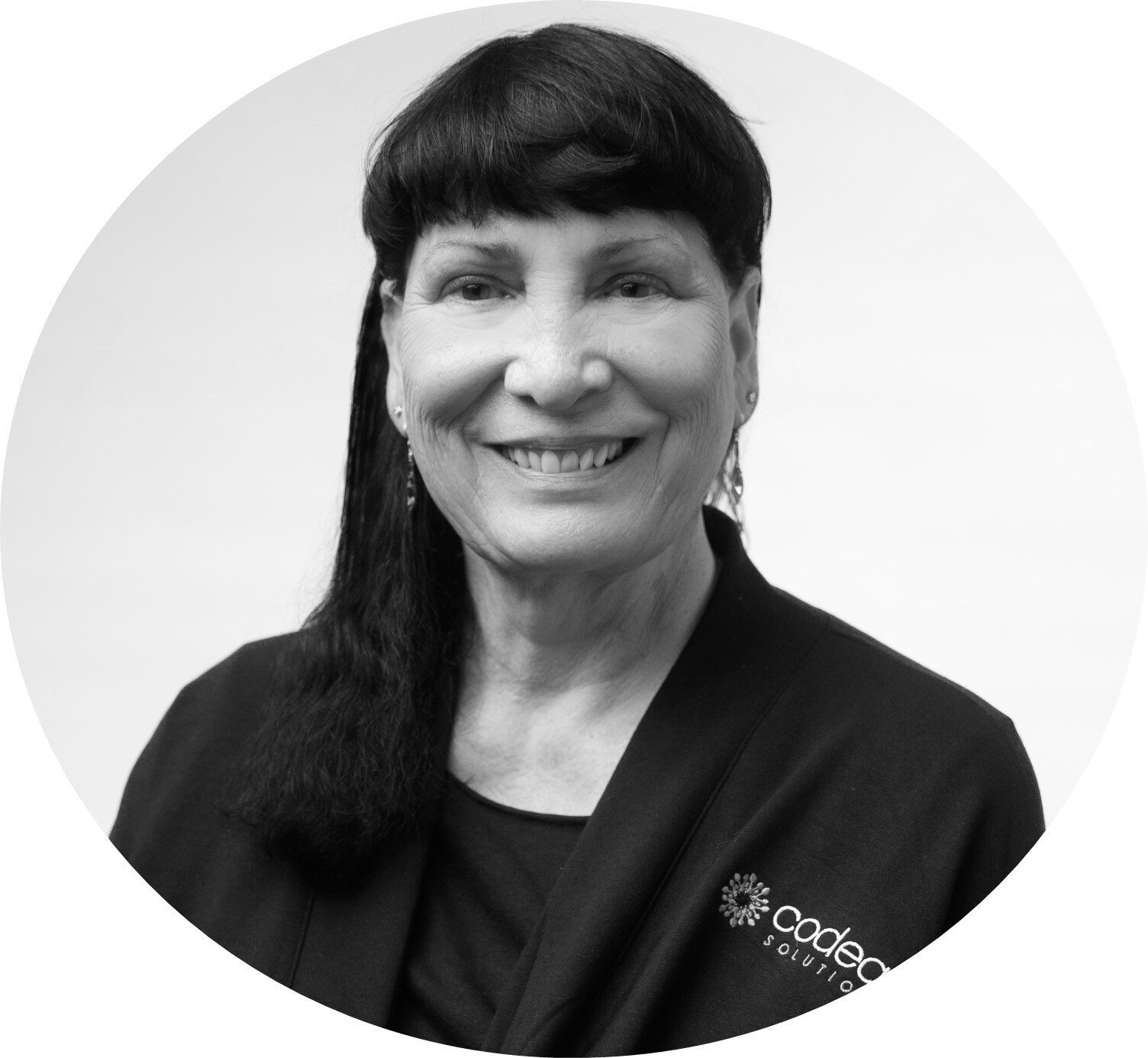 Black and White head shot photograph of Dr Catherine Riddle, PhD, the Co-inventor and technical advisor at Codeac Solutions, inc